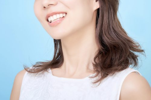 portrait of young woman with blue back